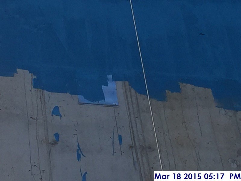 Continued waterproofing the shear wall at the South Elevation